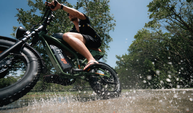 Freego F3 Pro ebike splashing through water on a summer ride