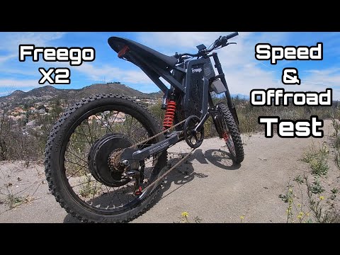 Electric bike with 'Freego X2' and 'Speed & Offroad Test' text against a scenic background.