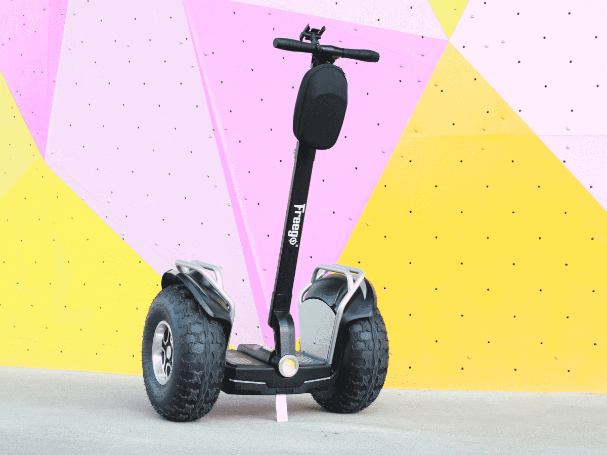 Segway with a black handlebar on a colorful geometric background