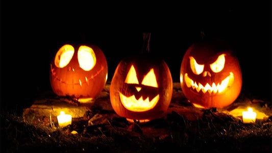 Glowing Halloween carved pumpkins with candles for Halloween celebration ambiance
