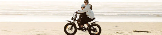 Mother and child riding a high-quality Freego electric bicycle on the beach, highlighting commitment against low-quality imitations