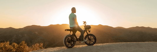 A man on his perfect electric bike watching sunset. The picture makes you want to choose the right ebike for yourself too!