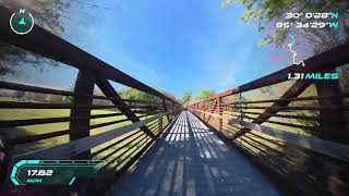 First-person view of a high-speed electric scooter ride across a metal pedestrian bridge