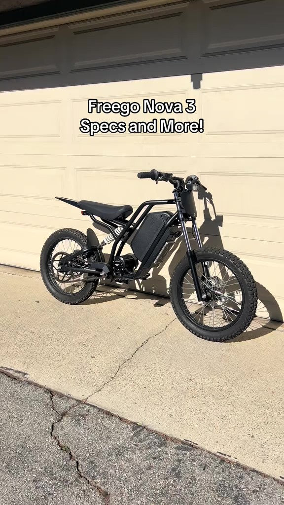 Black Freego Nova 3 parked in front of a beige garage door with text overlay.