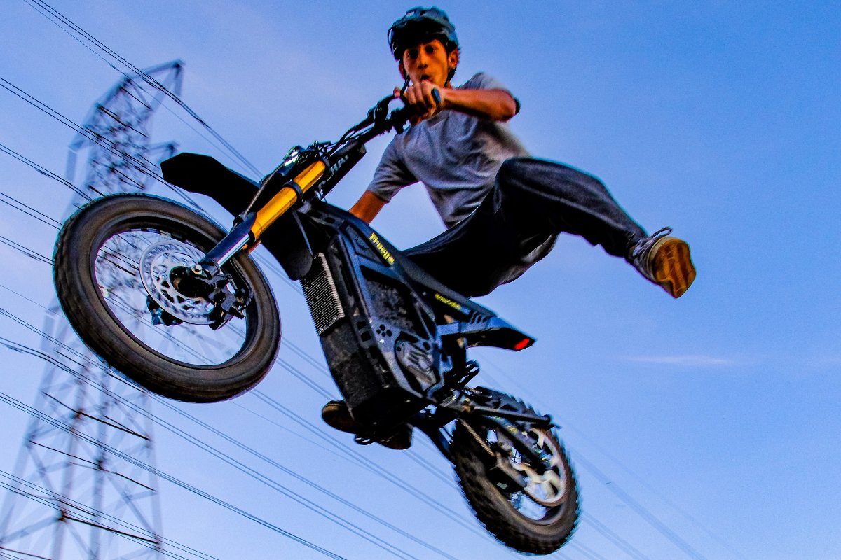 A rider soaring through the air on the Freego Nova 5 Mini, showcasing its powerful performance and ability to conquer all terrains with ease.