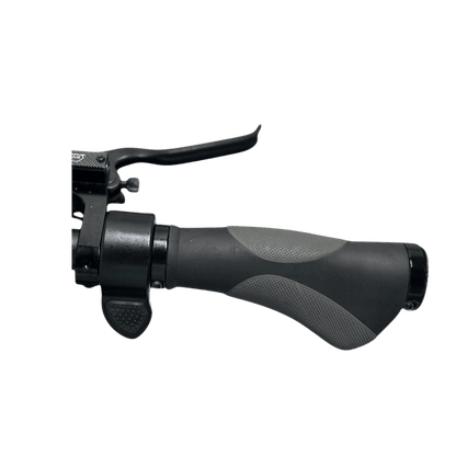 Close-up of a motorcycle handlebar grip and brake lever on a gray background