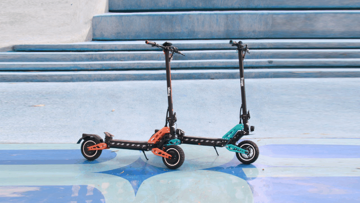 Freego C10 and C10 Pro electric scooters in vibrant blue and orange colors, positioned side by side against a colorful backdrop of steps, showcasing their modern design and versatility
