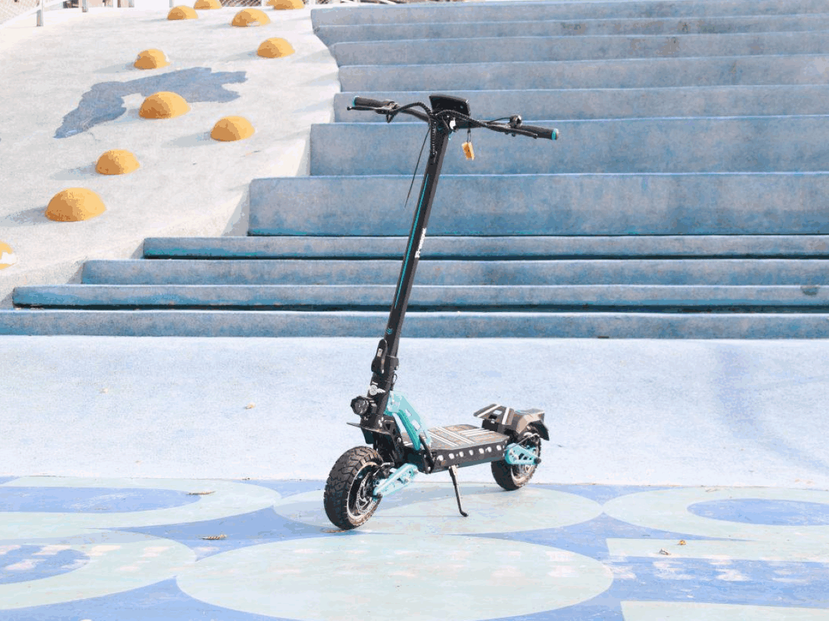 Electric scooter on a set of stairs with decorative elements in the background