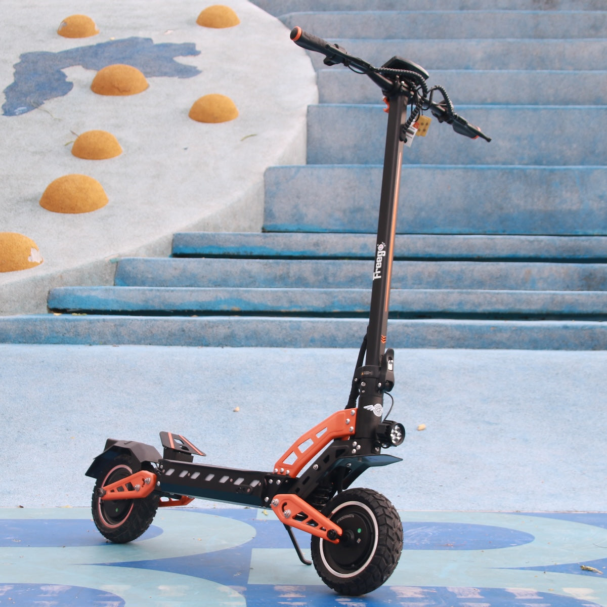 Scooter on blue steps area, no rider.