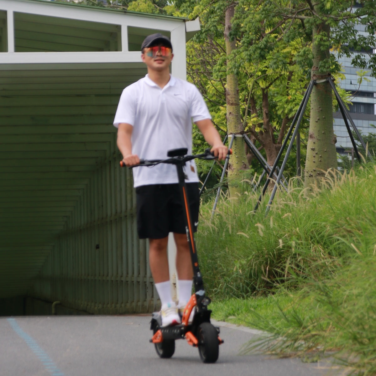 Freego C10 Pro E-Scooter outdoor person riding greenery scene