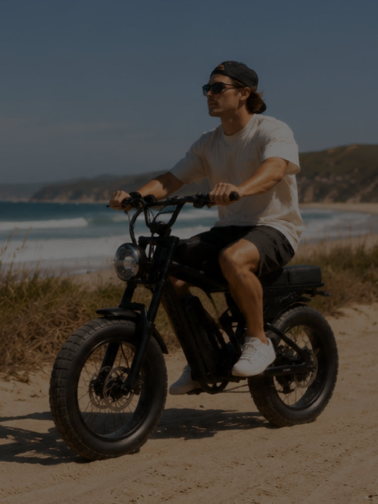 adult riding freego f0 fat tire near the beach