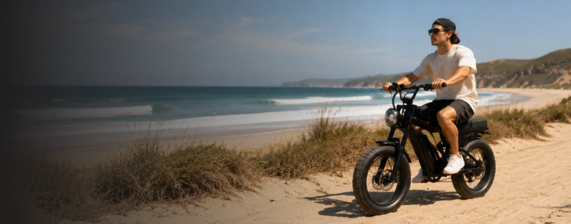 a man riding freego f0 fat tire eletrick bike near the beach