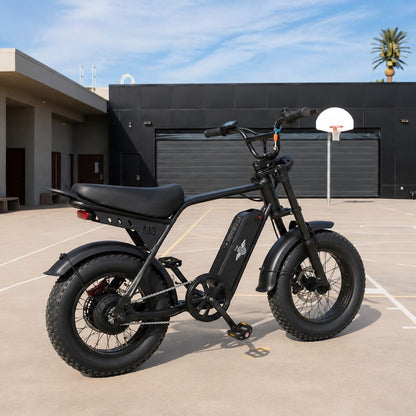 Freego M3 fat tire e-bike parked on an outdoor basketball court