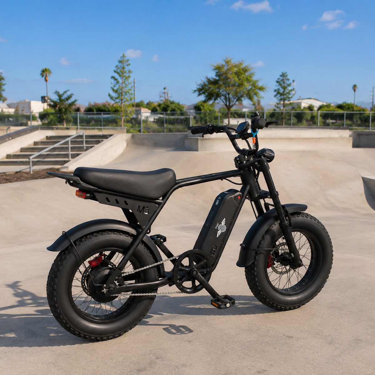 Freego M3 fat tire e-bike parked at a sunny outdoor skatepark