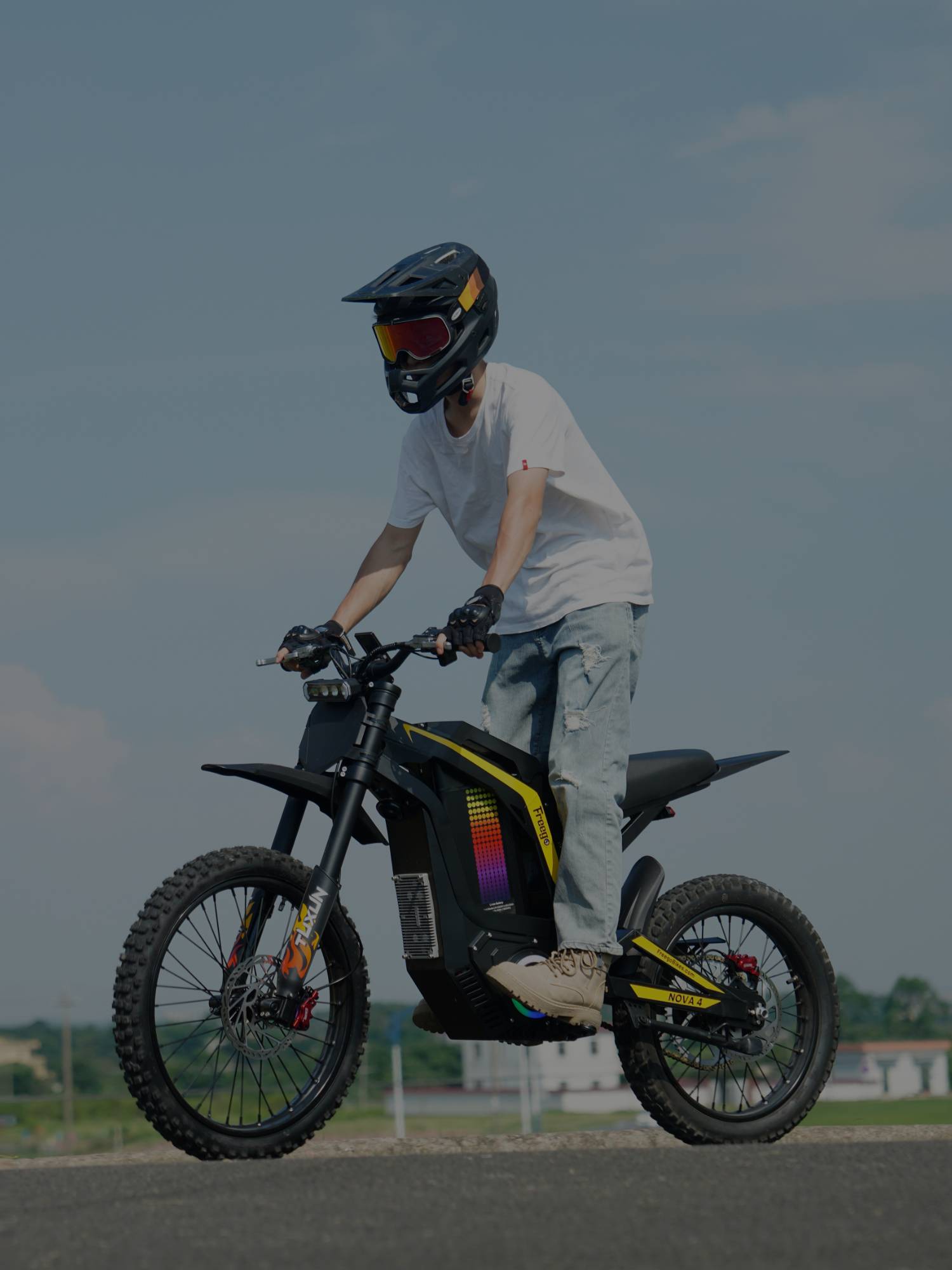 Rider on Freego Nova4 electric dirt bike front view, outdoor riding scene