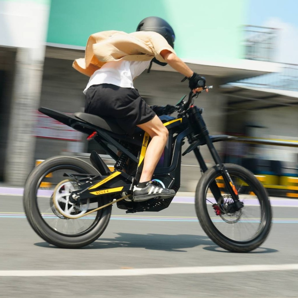 Rider speeding on Freego Nova4 electric dirt bike on city street