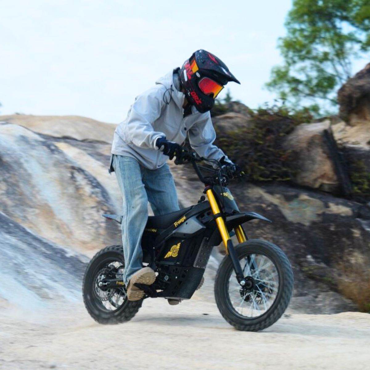 Person riding a Nova 5 Mini ebike on a rocky trail