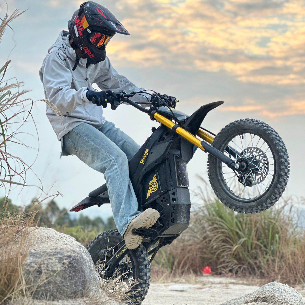 Person riding a Nova 5 Mini ebike in an outdoor setting with a helmet on
