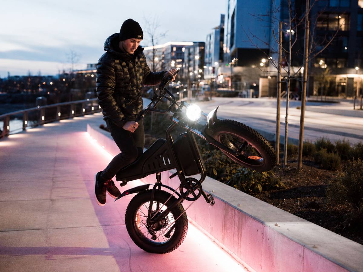 Rider on the Freego S1 ebike riding through city streets at night.