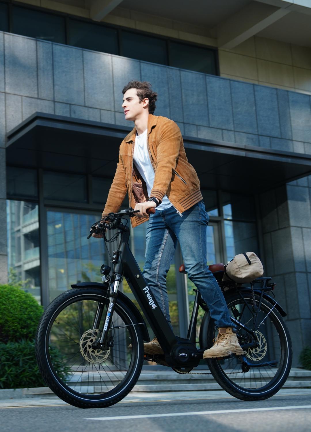 A rider commuting through a city street on a Freego electric city bike, showcasing a comfortable urban eBike design for daily transportation and modern mobility.