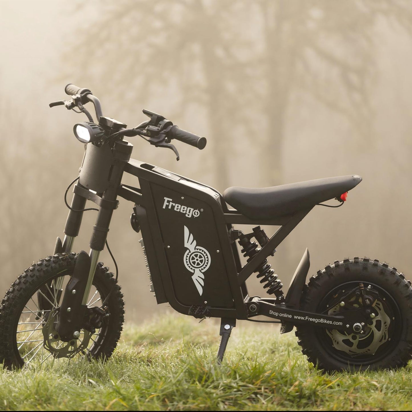 Freego X0 parked on a grassy field, showcasing its rugged off-road design and adventure-ready performance