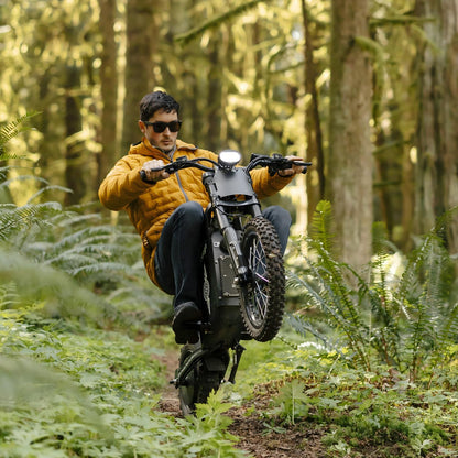 Rider performing an off-road ride on a Freego X0 through a forest trail, showcasing adventure, agility, and outdoor performance.
