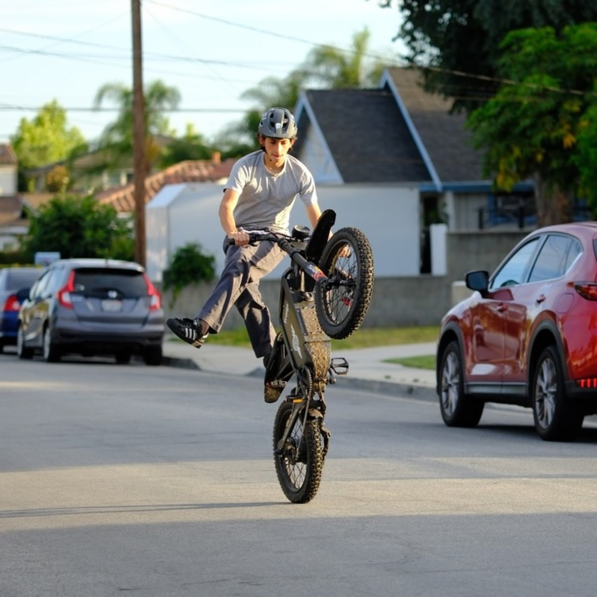 Freego X1 electric dirt bike wheelie balance stunt on street
