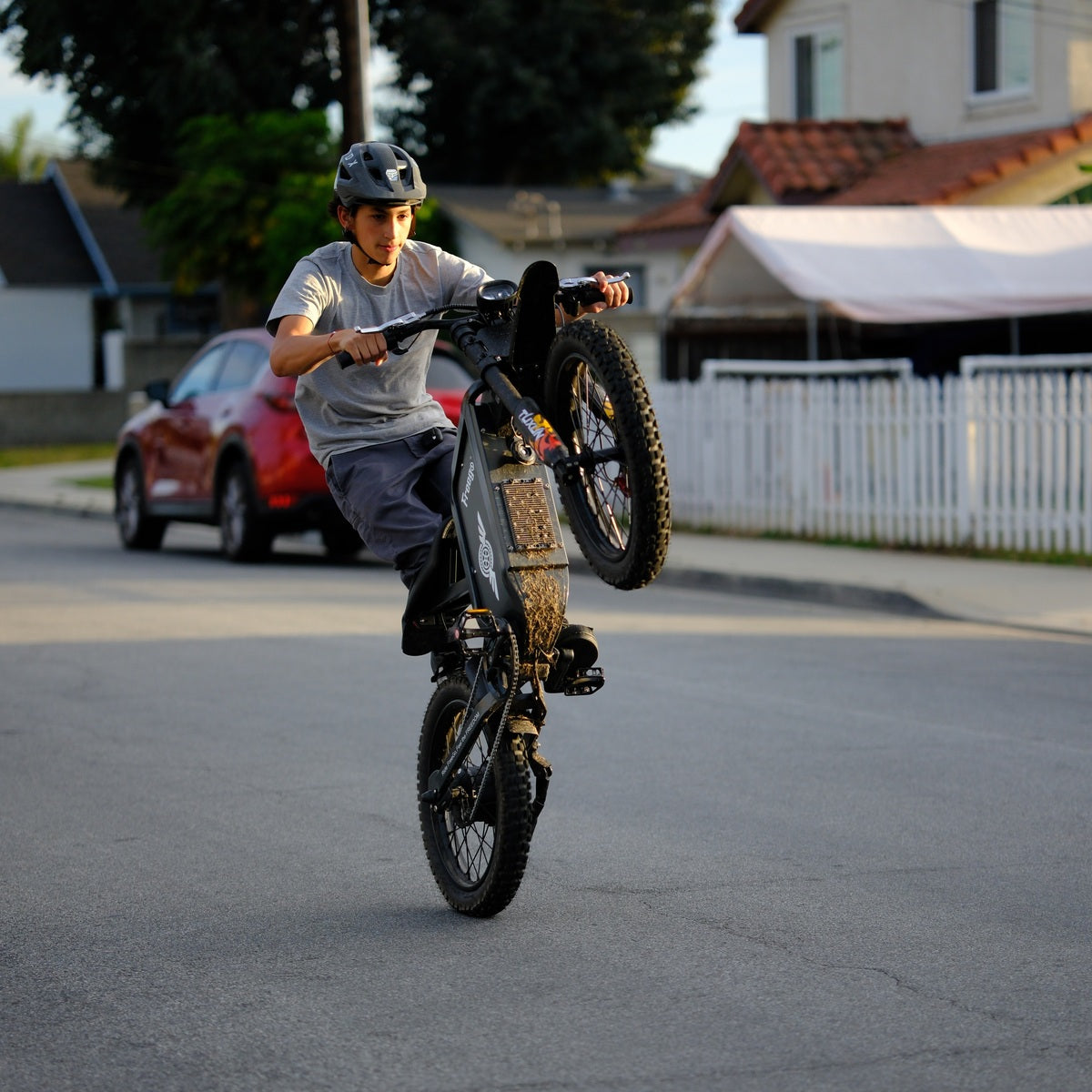Freego X1 electric dirt bike wheelie stunt performance on street