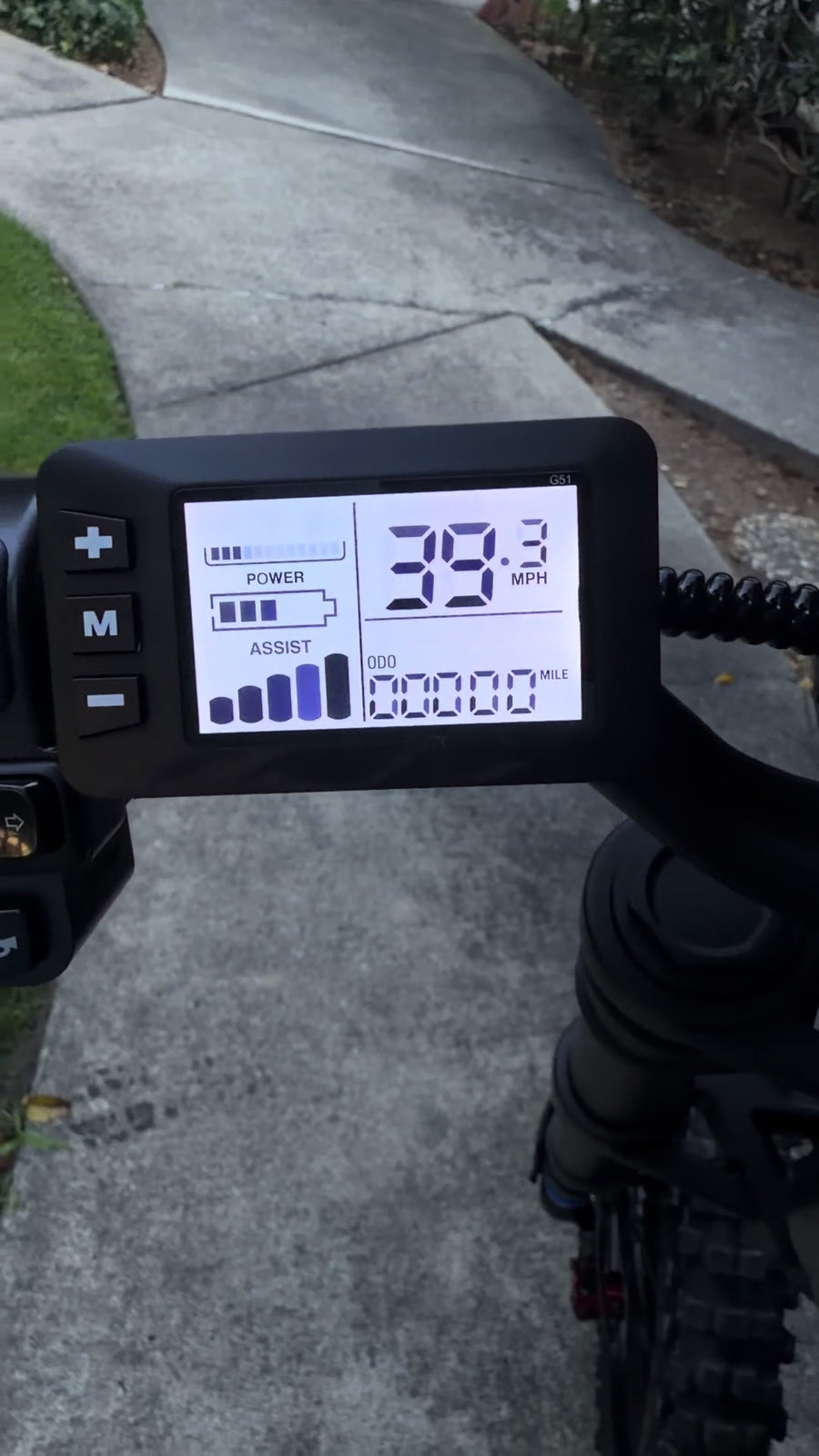 Close-up of an electric bike digital display showing speed and battery level.