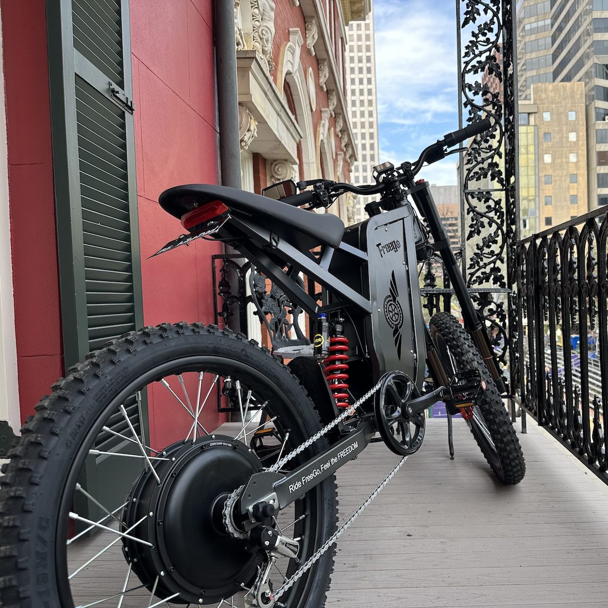 Freego X2 dirt ebike on a balcony with cityscape background