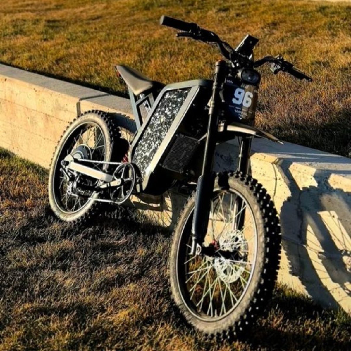 The X2 Pro dirt bike with large front wheel on a grassy area