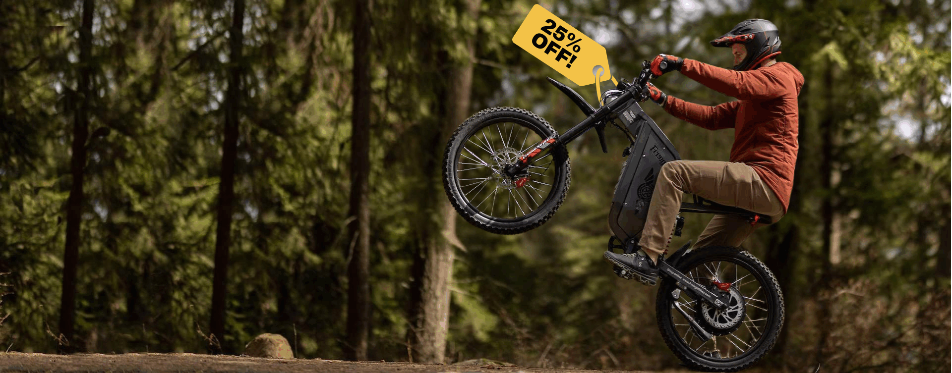 Person on a Freego X2 Pro ebike in a forest with a promotional banner in the background