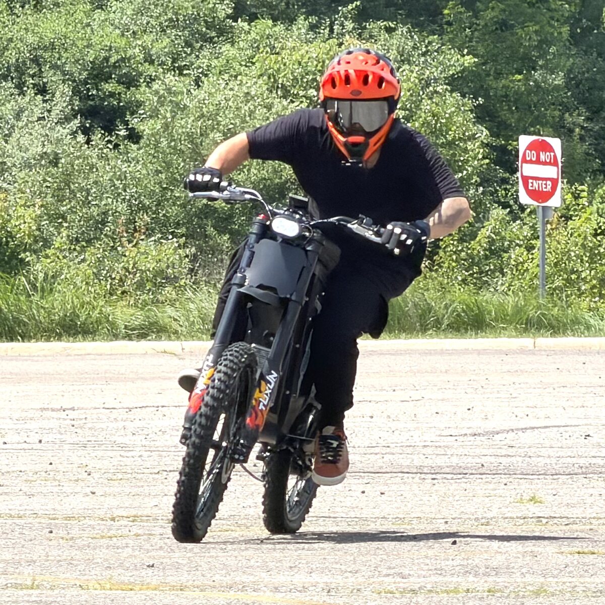 RunPlayBack riding Freego X3 Pro electric bike on paved road action shot