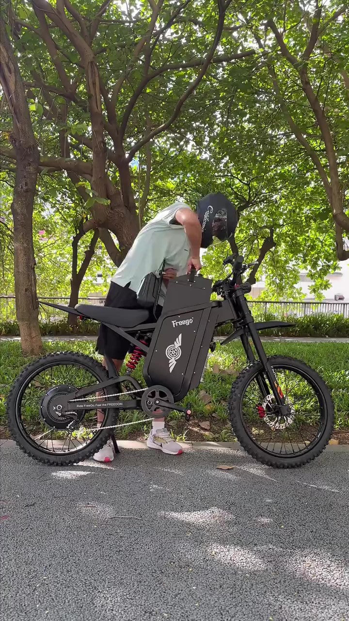 Person adjusting the freego x3 in a park setting