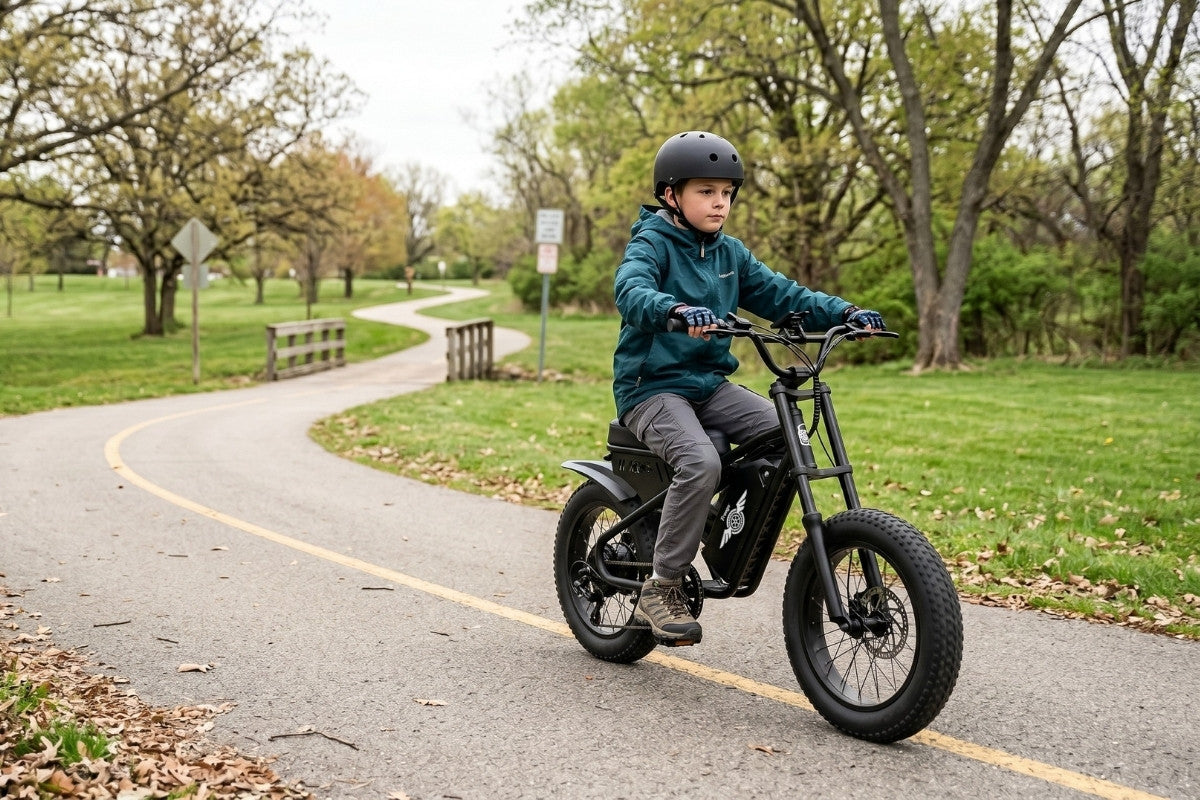 Child riding a freego m1 electric bike on a paved path in a park