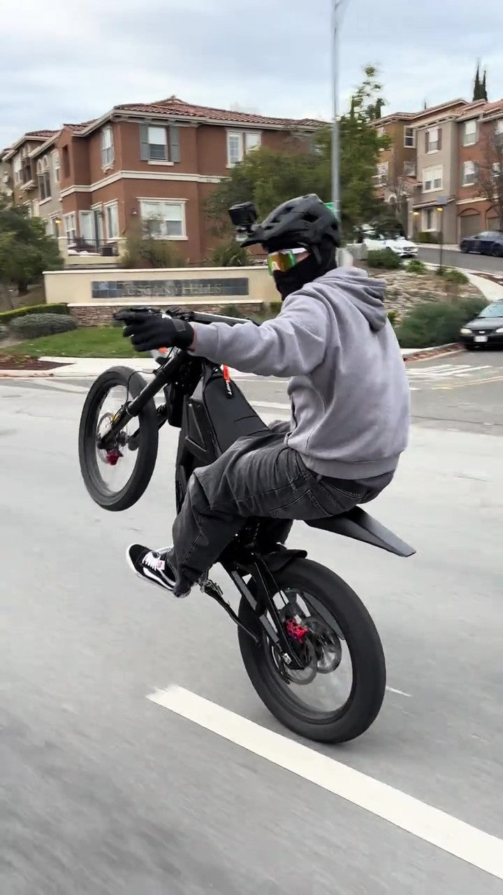 Person riding freego nova 5 on a residential street