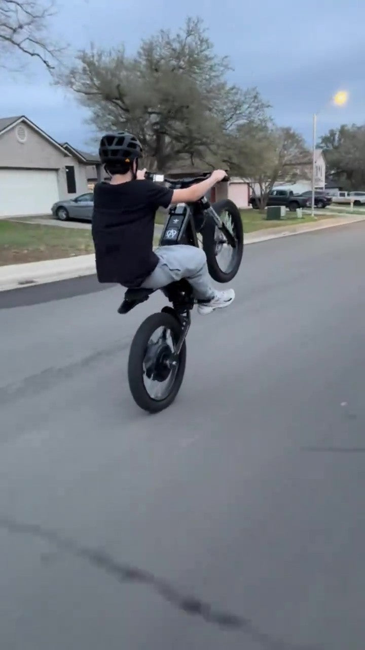 Person riding freego x2 pro on a residential street